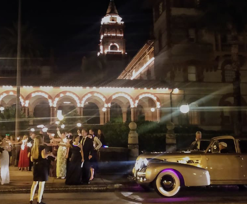 Classic wedding limo at an evening celebration